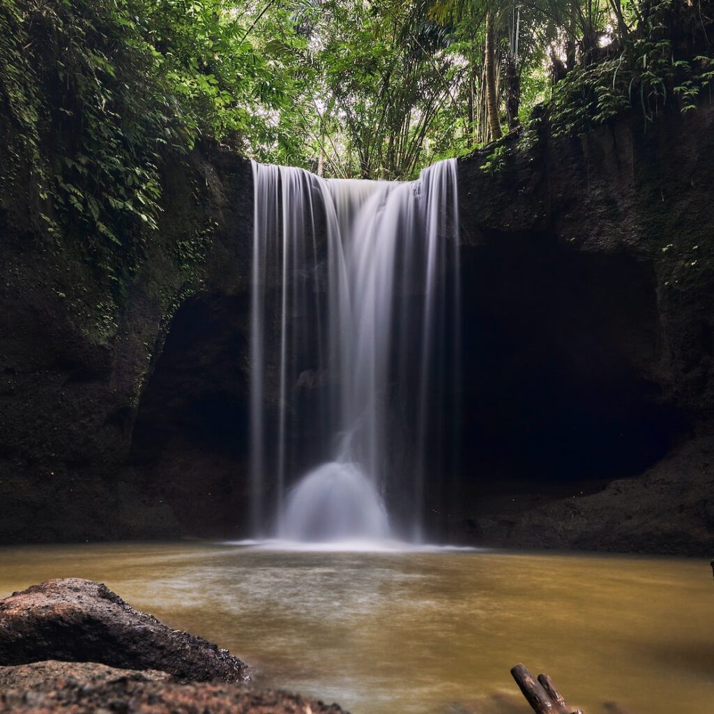 a waterfall in a forest